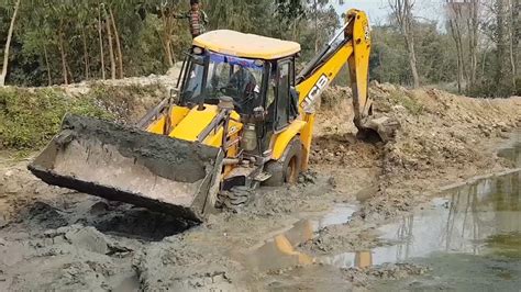 mini digger stuck in mud|dozers working in mud videos.